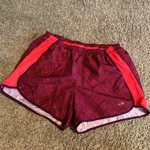 TWO pairs of Champion track shorts